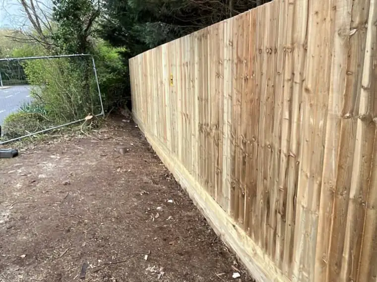 The same new fence line seen from the garden side